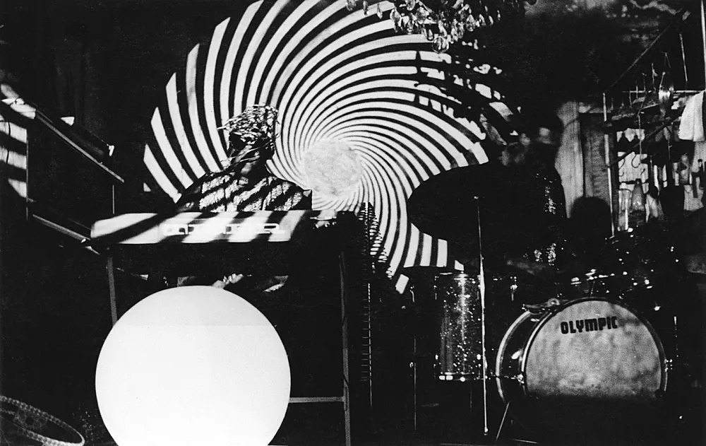 an exhibition organized by Diedrich Diederichsen amp Christopher Müller feat. Marcus Behmer, Stefan George, Rainer Werner Fassbinder, Hans Henny Jahnn, Lutz Bacher, Hans Kayser, Ludwig Gosewitz, Jordan Belson, Hapshash and the Coloured Coat, The Fool, Rogério Duarte, The Red KrayolaMayo Thompson, Walter de Maria, Sigmar Polke, Emil Schult, Isaac Abrams, John McCracken, Pedro Bell, Kai Althoff, Henrik Olesen, Öyvind Fahlström, Karlheinz Stockhausen, Sun Ra, Hartmut Geerken, Albert Oehlen, Jack Goldstein, Jutta Koether, Isa Genzken, Palermo, John Coltrane, Tony Conrad — Cosmic Communities Coming Out Into Outer Space Homofuturism, Applied Psychedelia amp Magic Connectivity — Exhibitions — Galerie Buchholz — Image 00